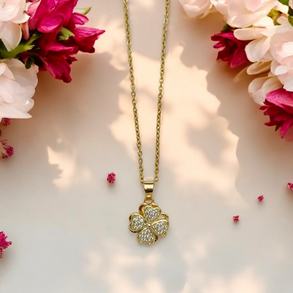 Twist of Gold Necklace – Spinning Clover Pendant