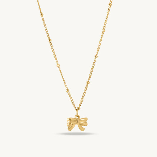 Golden Bow Charm Necklace – Dainty Elegance in Gold