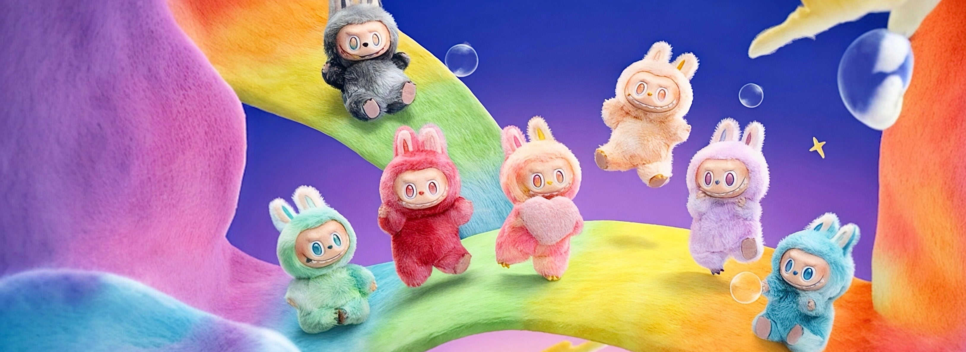 Colorful plush toys in bunny costumes on a rainbow with a starry sky backgroundslider_item_LceXMc