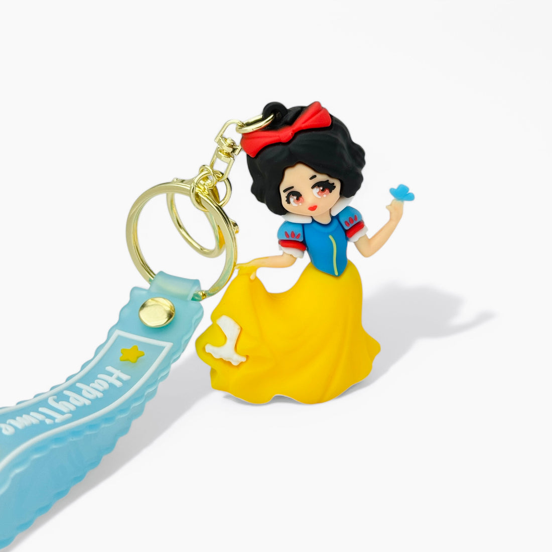 Cartoon Snow White in blue and yellow dress holding a blue bird keychain