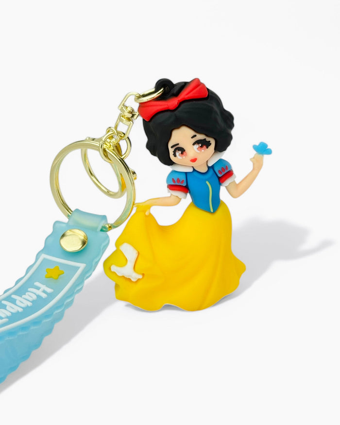 Cartoon Snow White in blue and yellow dress holding a blue bird keychain